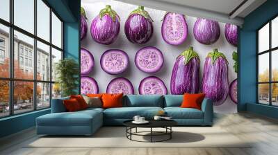 Fresh striped eggplants arranged on a white background. Wall mural