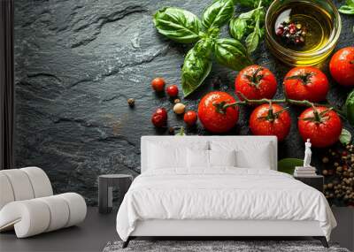 Fresh tomatoes, basil, and spices on a black slate background. Wall mural