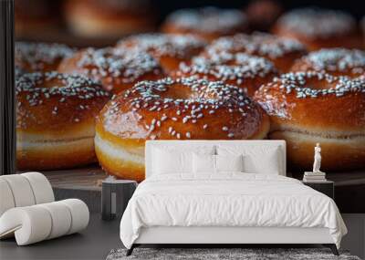 Freshly baked donuts with a sprinkle of sugar on a wooden board. Wall mural