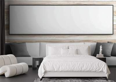 White sofa with grey pillows in front of a blank canvas. Wall mural