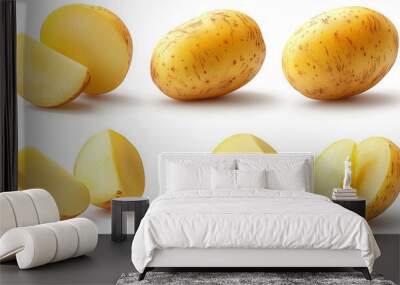 Whole and sliced yellow potatoes on a white background. Wall mural