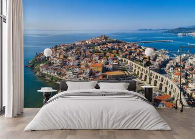 Aerial view the city of Kavala in northern Greek, ancient aqueduct Kamares, homes and medieval city wall Wall mural