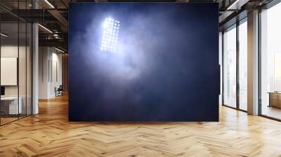 stadium lights and smoke against dark night sky background Wall mural