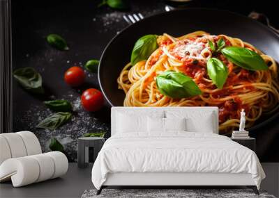 Delicious appetizing classic italian spaghetti pasta with tomato sauce, parmesan cheese and basil on a plate on a dark table. Wall mural