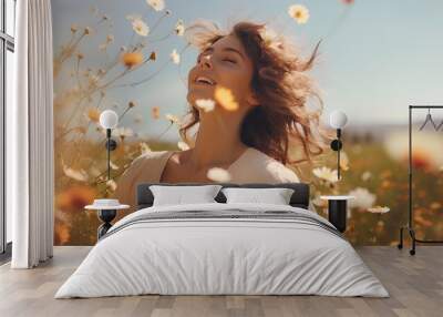 A happy woman in a field of flowers Wall mural