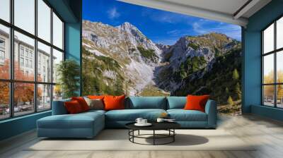 View to beautiful valley and Mali Draski vrh in Slovenian alps Wall mural