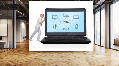 Businessman pushing laptop Wall mural