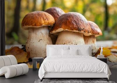 Fresh boletus mushrooms displayed on a charming rustic wooden table, perfect for culinary purposes Wall mural