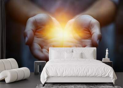 Illuminated prayer hands in worship  a symbol of spirituality and devotion to god Wall mural