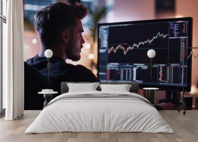 Man examining forex chart on computer screen in his office workspace for analysis Wall mural