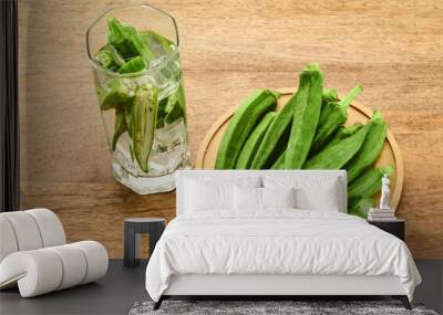 Fresh Okra water on wooden background Wall mural