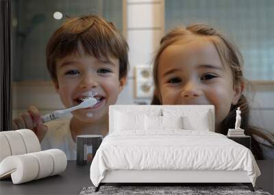 Little girl and boy brushing teeth. Wall mural