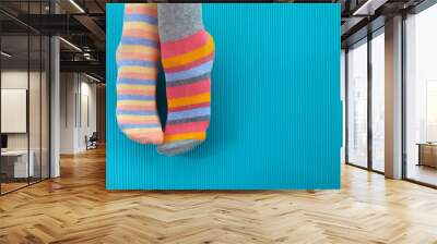 Odd Socks Day. Day lost socks, lonely socks on blue background. Wall mural