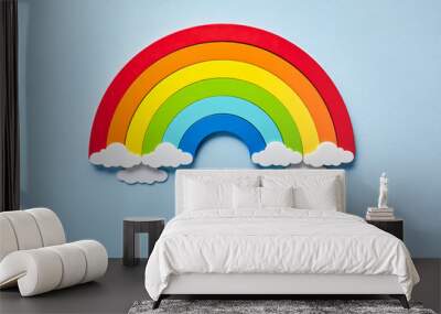 Vintage flat card with rainbow with white clouds on blue background. Chase the rainbow Wall mural