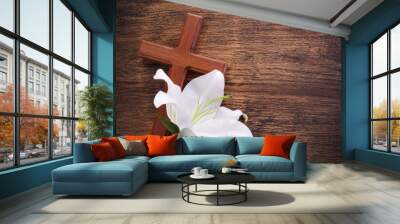 Wooden cross and white lily on rustic table Wall mural