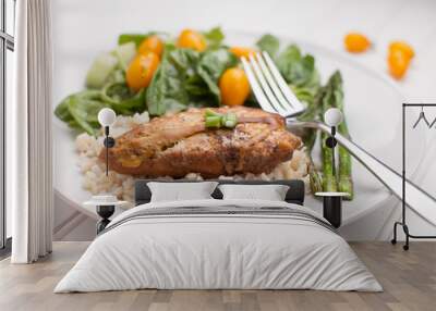 Dinner plate of lemon pepper mustard chicken with brown rice, Italian garden salad, and asparagus cooked in avocado oil on white horizontal view Wall mural