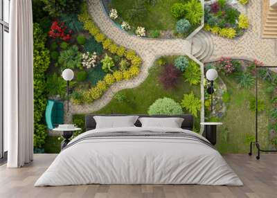 Garden with walkways and green grass. Photo taken from above drone. Wall mural