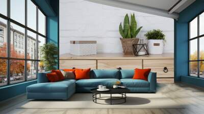 Interior living room with a wooden chest on a white brick wall Wall mural