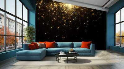 Fiery golden glowing star-like particles falling down over black background. Wall mural