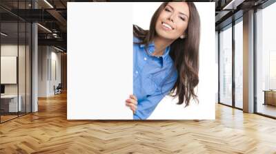 Beautiful young woman showing blank signboard Wall mural