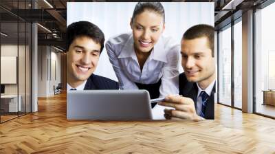 Businesspeople working with laptop at office Wall mural