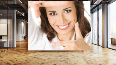 Businesswoman framing her face with hands, isolated Wall mural