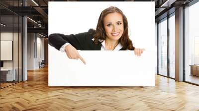 Businesswoman showing blank signboard, isolated Wall mural