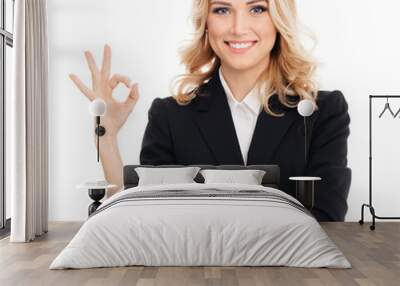 businesswoman showing okay gesture, isolated Wall mural