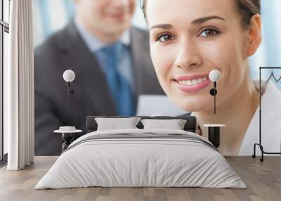 portrait of businesswoman and colleague on background Wall mural