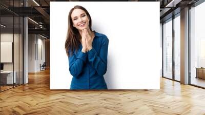 Portrait of happy gesturing smiling brunette lovely woman in casual smart blue clothing, isolated against white background. Caucasian brunette model in emoshions and feeling concept. Wall mural