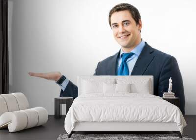 Portrait of happy smiling businessman showing, isolated Wall mural