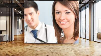 portrait of happy smiling patient and doctor on backgroud Wall mural