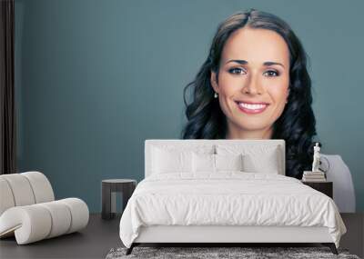 Portrait of young happy smiling businesswoman Wall mural