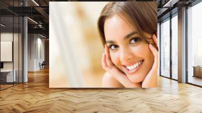 Portrait of young woman at home Wall mural