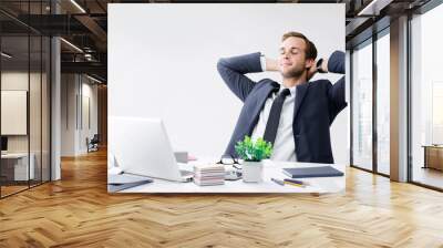 Relaxing or dreaming businessman at office Wall mural