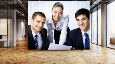 Three businesspeople working at office Wall mural