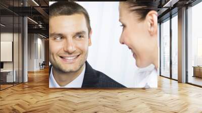 Two smiling young businesspeople Wall mural