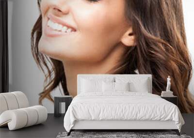 Woman touching skin or applying cream, isolated Wall mural