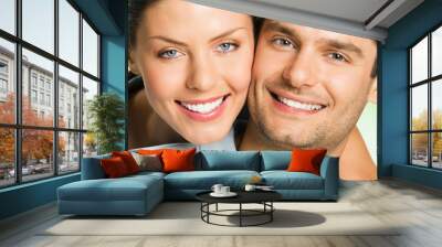 Young happy smiling attractive couple, outdoors Wall mural