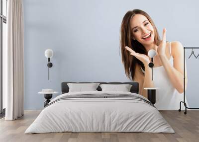 young woman showing smile, with copyspace Wall mural