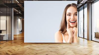 young woman showing smile Wall mural