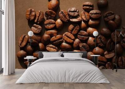 Coffee beans close up on a brown background. Coffee mood. Wall mural