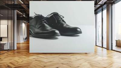 Pair of black leather shoes on white background, 4K hyperrealistic photo Wall mural