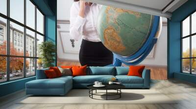 Business woman with the globe Wall mural