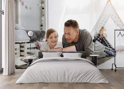 Clever young dad sharing his daughters hobby Wall mural