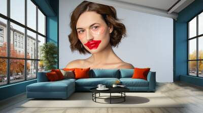 Female with a collagen lip mask and hydrogel eye patches Wall mural