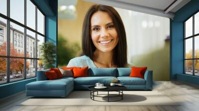 great mood. pleasant cheerful woman smiling while looking at you Wall mural