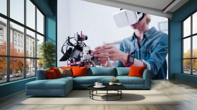 Smart innovations. Selective focus of an innovative robot being touched by a nice attractive pleasant woman Wall mural