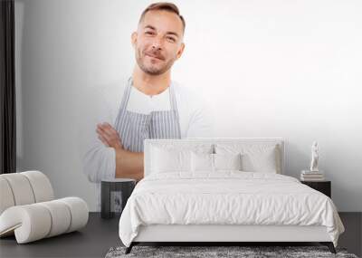 Smiling man in apron folding his arms across chest Wall mural