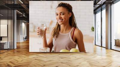 Woman having healthy diet drinking water in the morning Wall mural